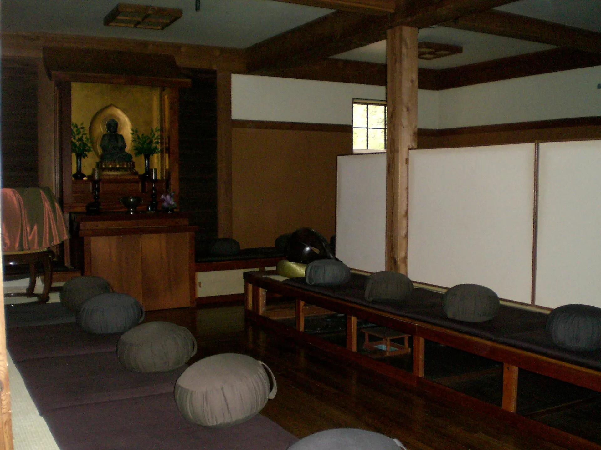 A Soto Zen meditation hall, round cushions arranged for zazen before a simple altar